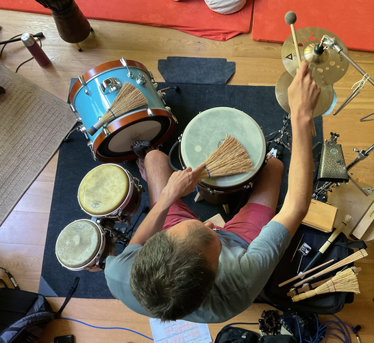 Photo of Matej behind the drums